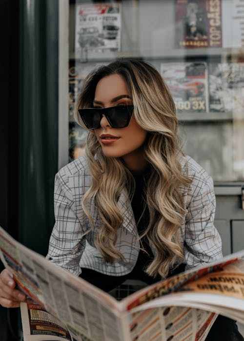 Woman in Black Sunglasses and White and Black Plaid Shirt