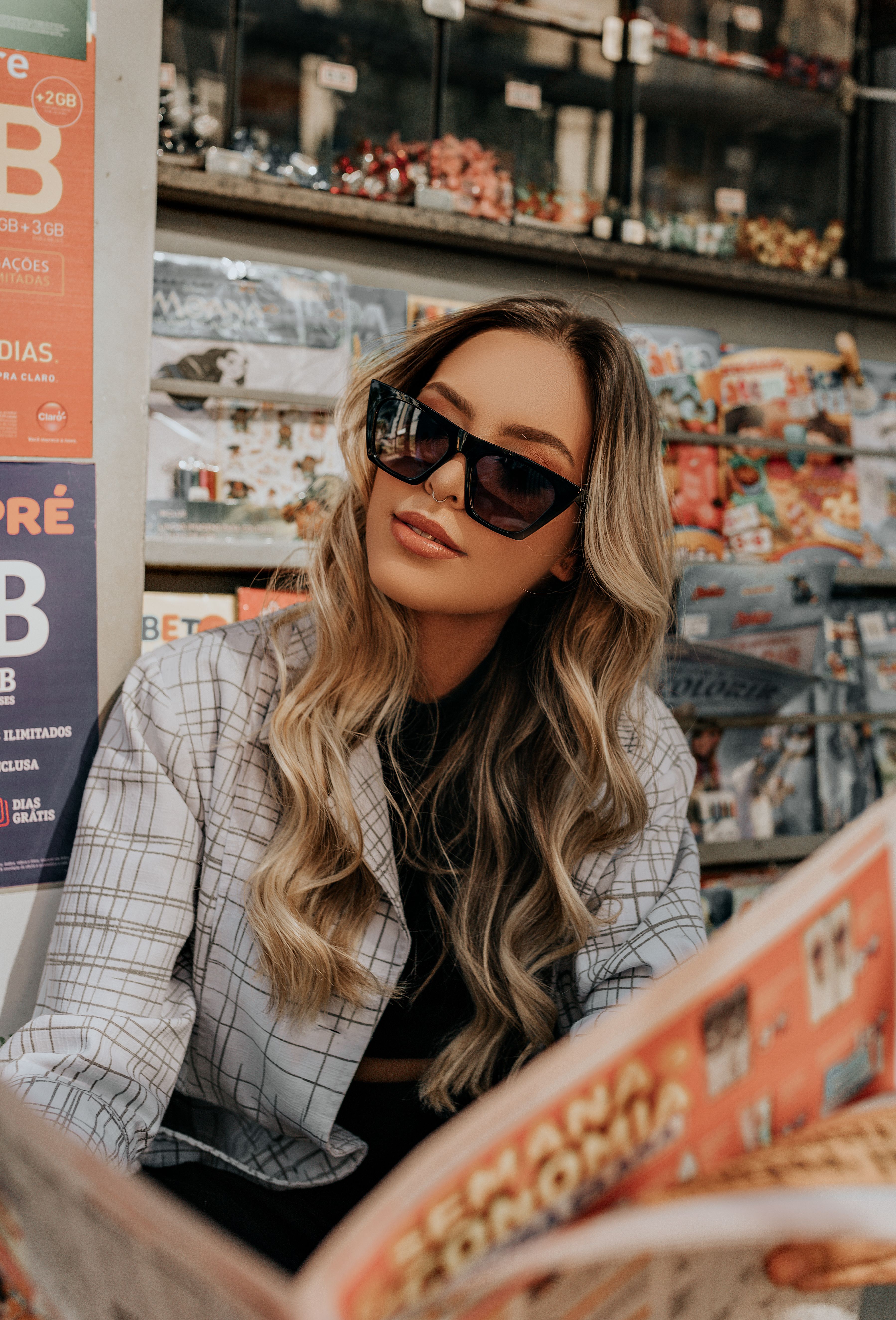 Woman in Black Sunglasses and White and Black Plaid Coat · Free Stock Photo