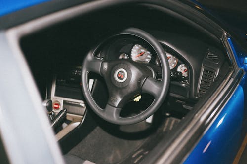 Black Steering Wheel of a Blue Car