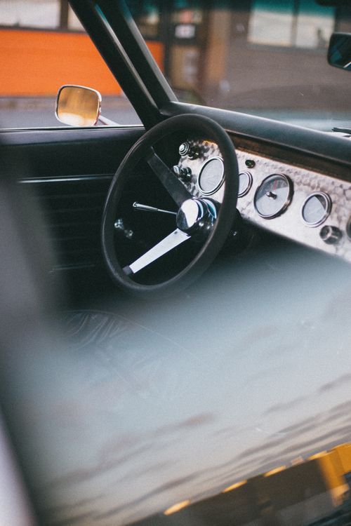 Free Vintage car dashboard and steering wheel close-up, showcasing classic design. Stock Photo