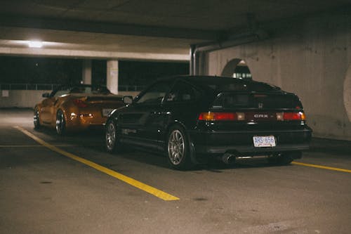 Free A Black Vintage Honda Civic CR-X Parked in a Parking Lot Stock Photo