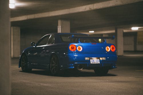 A Blue Nissan Skyline GT-R Parked in a Parking Lot
