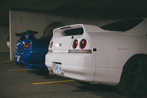 Rear Part of Two Nissan Skyline GT-R Parked Next to Each Other