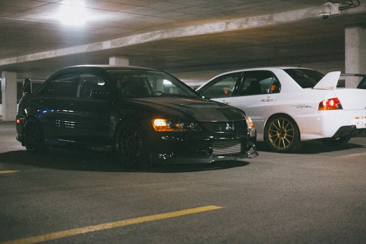 Two Mitsubishi Lancer Evolution Parked Next To Each Other