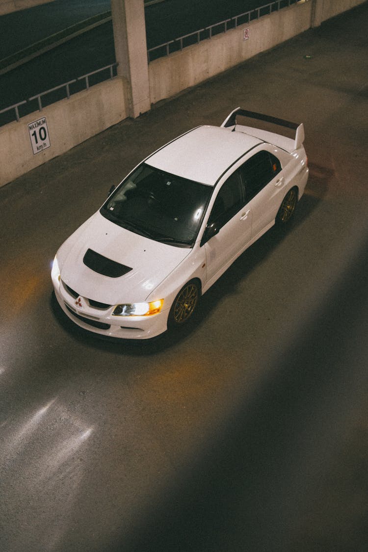 High-Angle Shot Of A White Mitsubishi Lancer Evolution