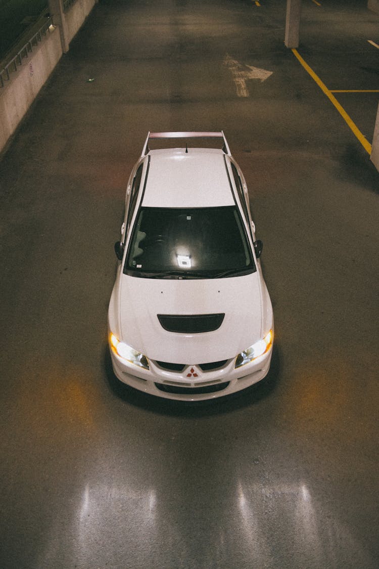 High-Angle Shot Of A White Mitsubishi Lancer Evolution