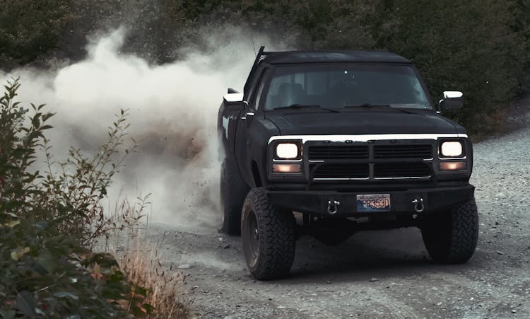 Black Pickup Truck On Dirt Road