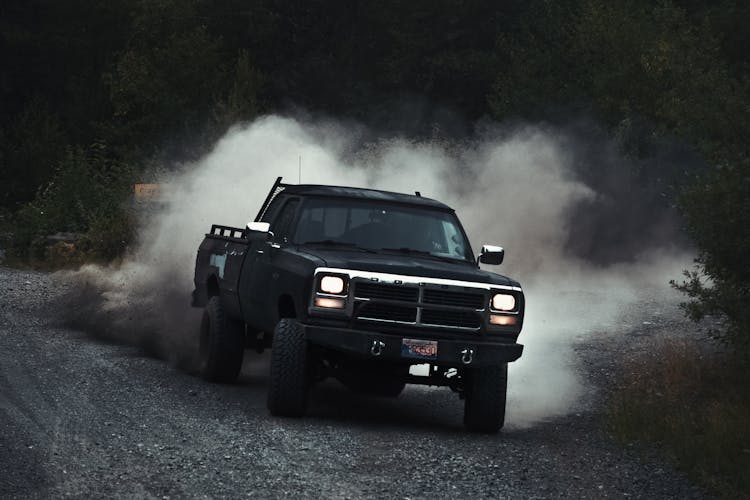 Black Pick Up Truck Driving On Off Road