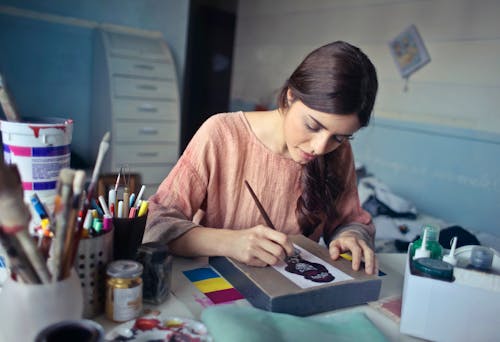 Woman in Brown Scoop-neck Long-sleeved Blouse Painting