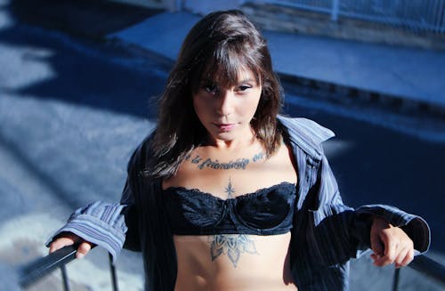 A Woman with Tattoo Wearing Black Brassiere