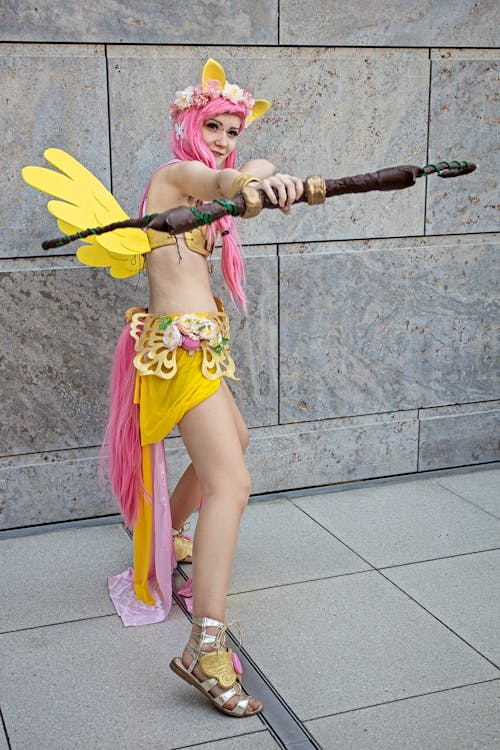 Woman Wearing Yellow and Pink Costume 