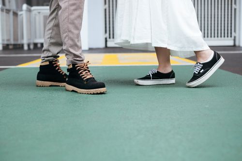 Free Close-up of trendy shoes on concrete. Urban fashion vibe. Stock Photo