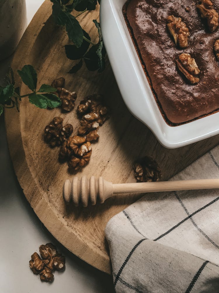 Walnuts And Honey Dipper On A Platter