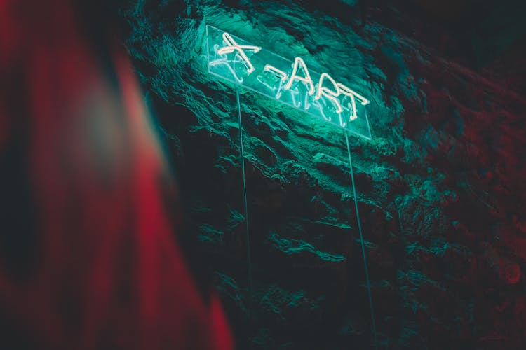 Lighted Neon Signage Hanging On The Wall