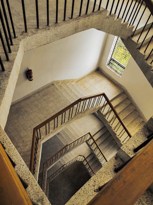 High-Angle Shot of Spiral Staircase Inside the Building