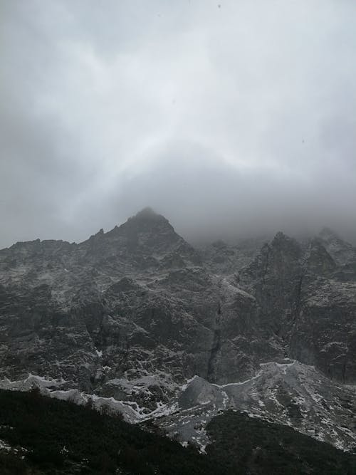 Gray Rocky Mountain Under White Cloudy Sky