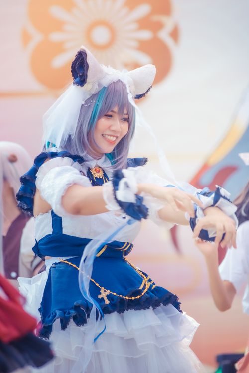 Free Smiling woman in elaborate costume at a cosplay event enjoying her performance. Stock Photo