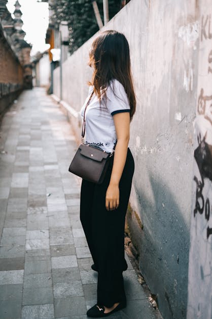 Woman Wearing Black and White T-shirt and Black Pants · Free Stock Photo