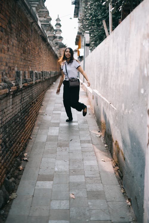 Woman Wearing White Shirt and Black Pants