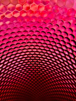 Bright red honeycomb pattern showcasing geometric and abstract art elements.