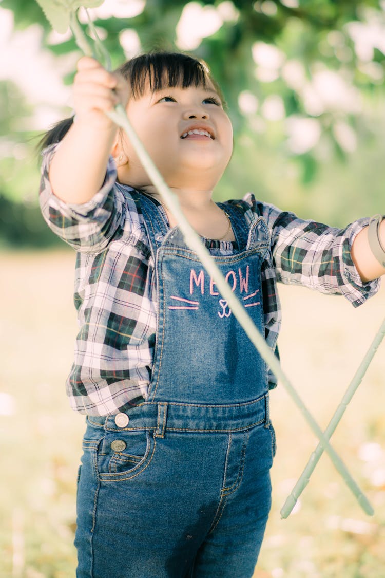 A Cute Girl Wearing Overalls