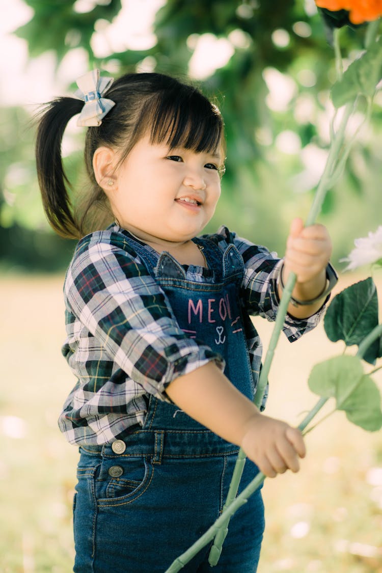 A Cute Girl Wearing Overalls