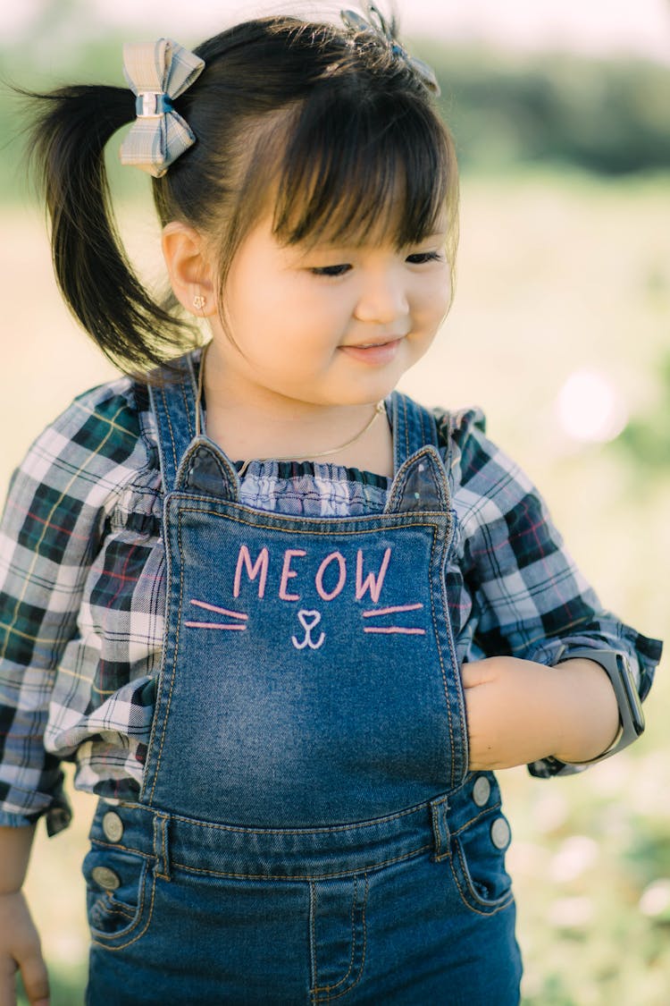 A Cute Girl Wearing Overalls