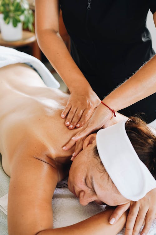 Free Woman Having a Body Massage Stock Photo