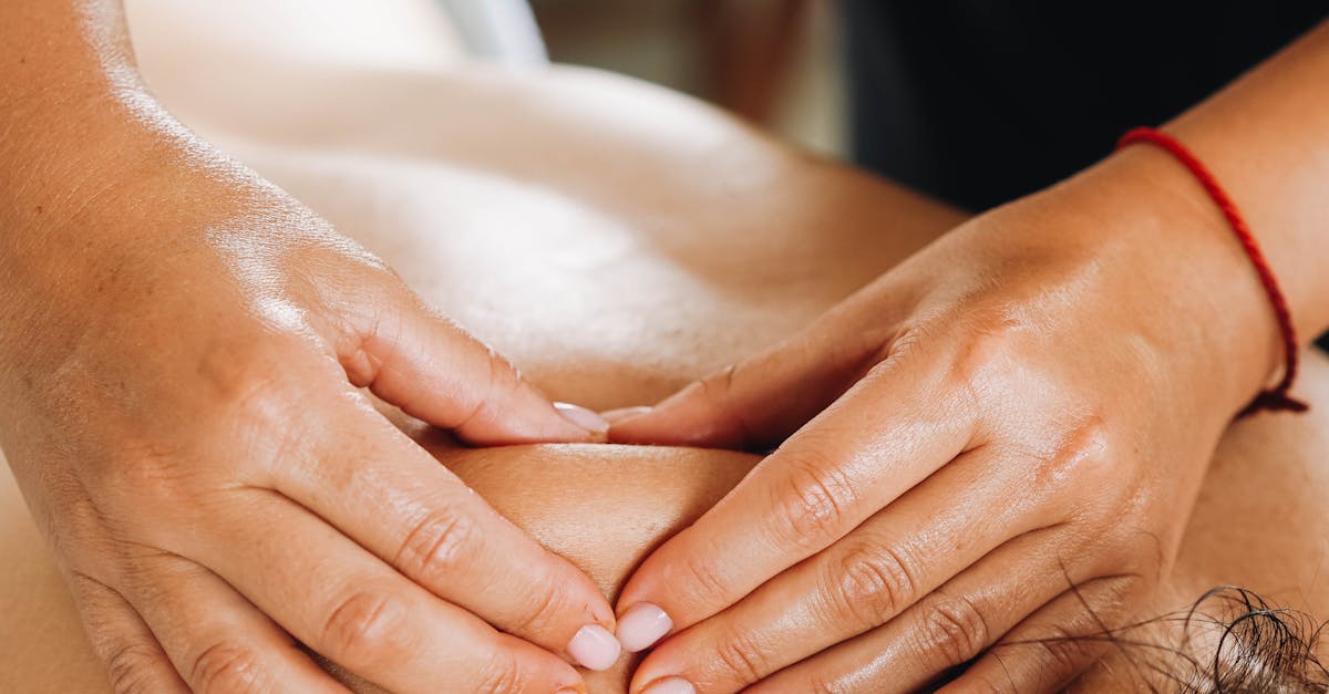 Person receiving a relaxing back massage from a professional masseuse.