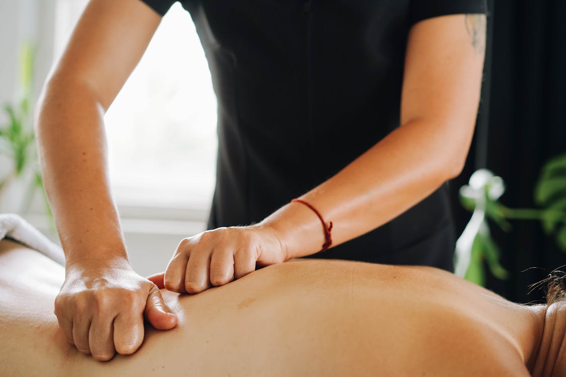 Therapist Massaging Client's Back