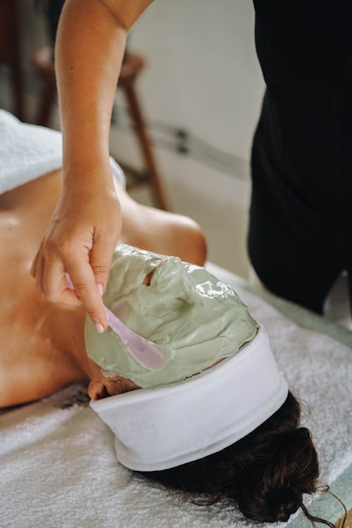 A Person with Facial Cream While Lying Down