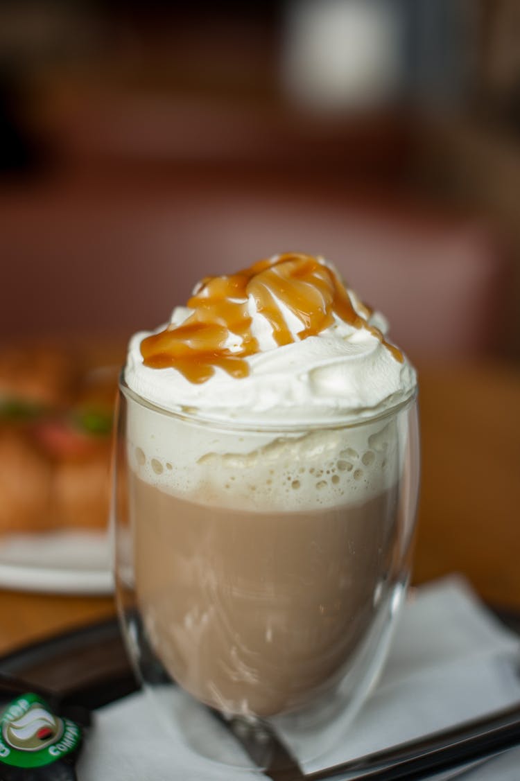 Close-Up Photo Of A Mocha Drink With Whipped Cream And Caramel On Top