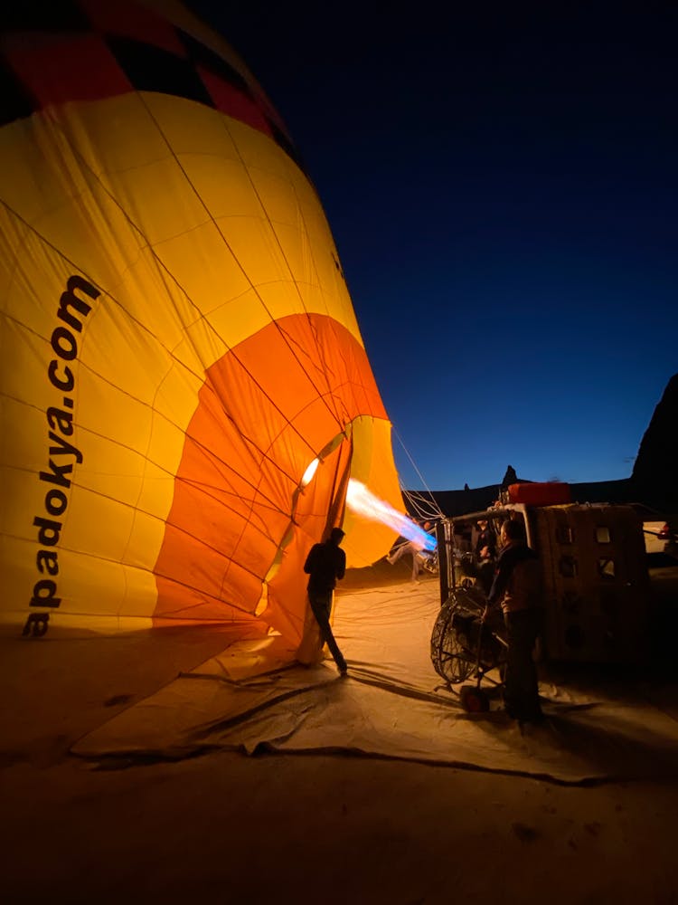 People Inflating Hot Air Balloon