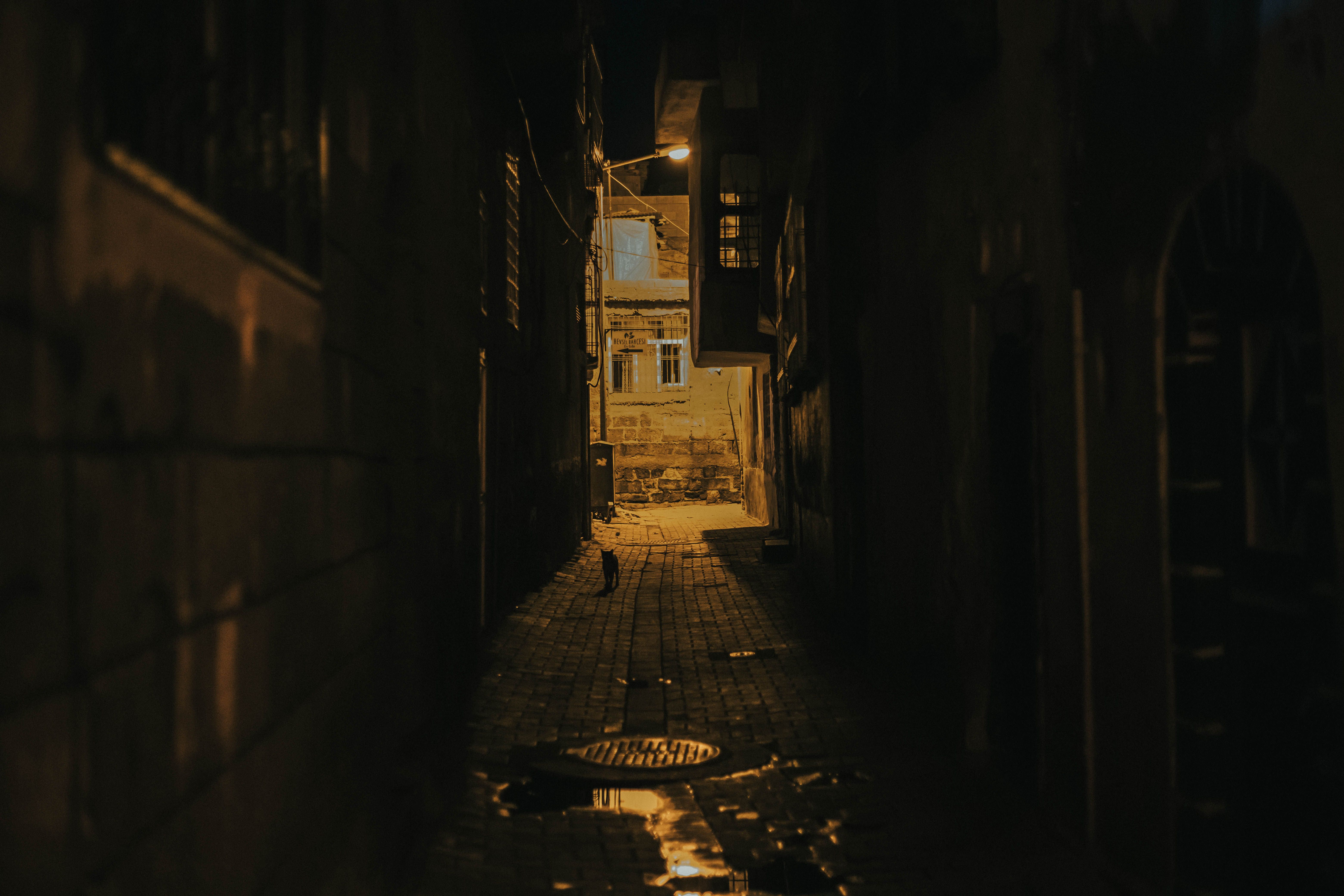 Dark Alley with Concrete Buildings · Free Stock Photo