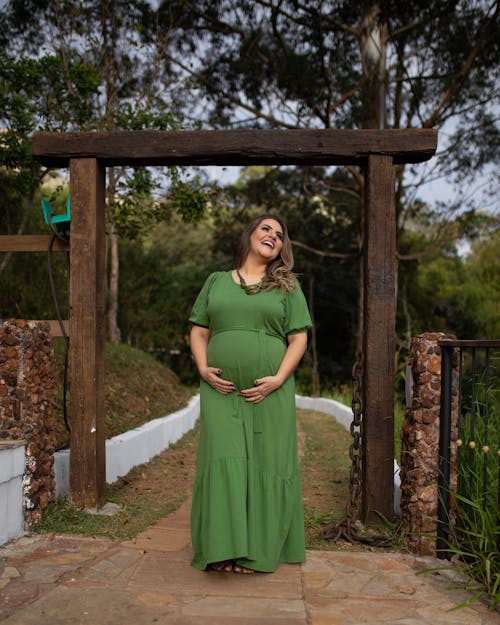 Pregnant Woman in Green Dress