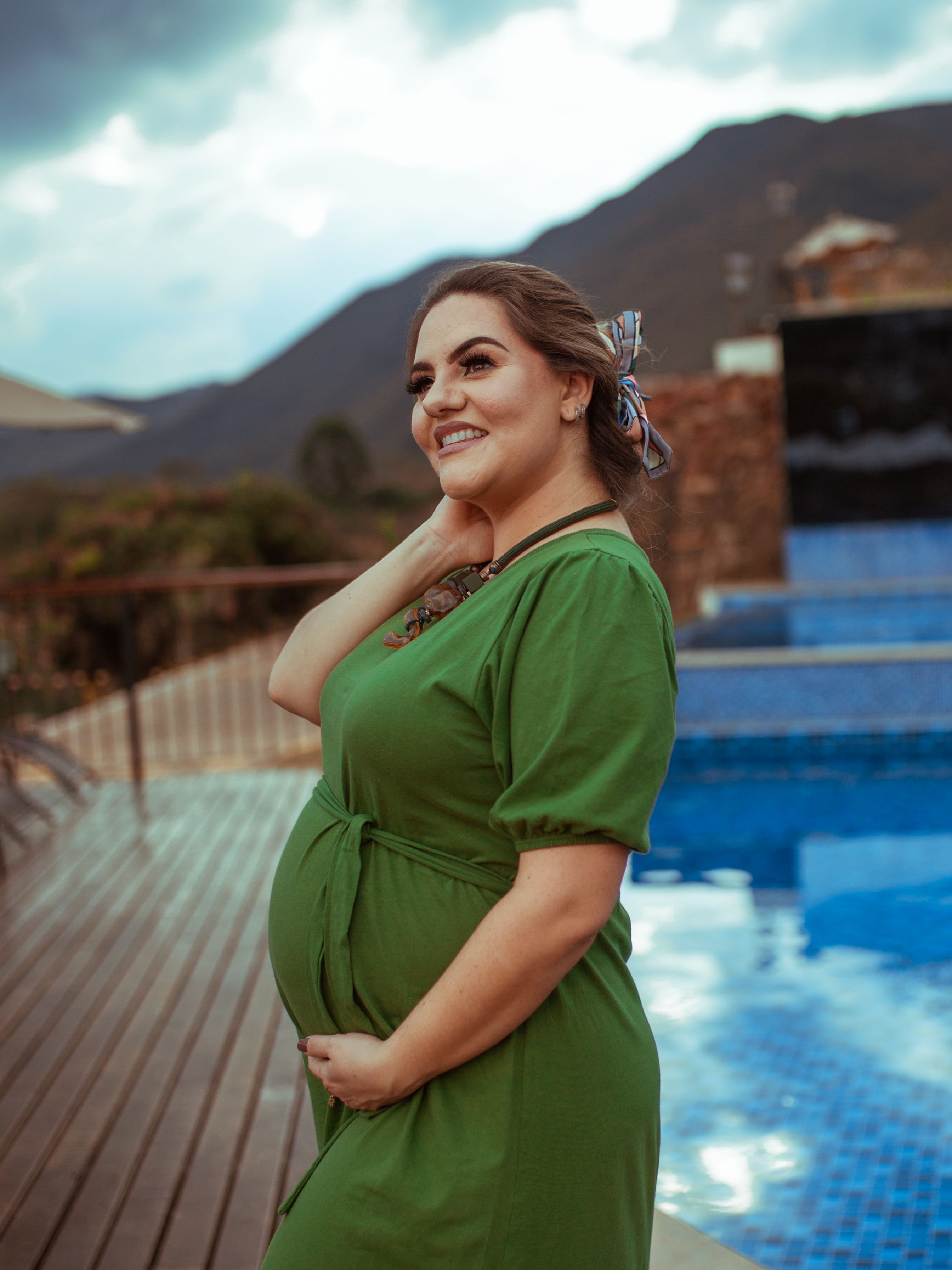 Pregnant Woman in Green Dress Smiling · Free Stock Photo