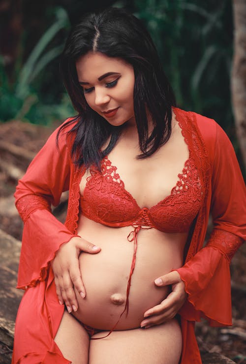 Free Woman in Red Lingerie Holding Her Baby Bum[ Stock Photo