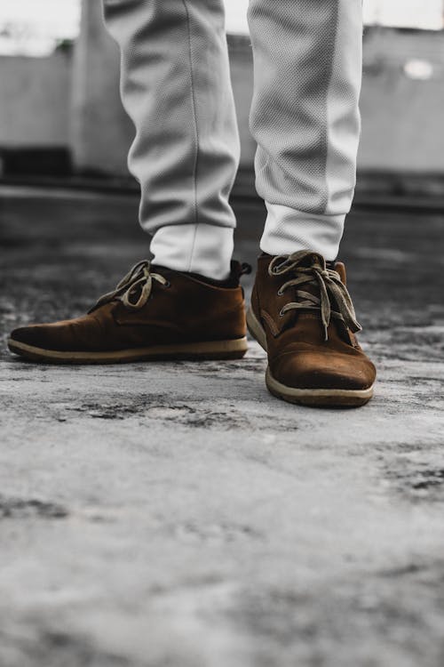 Person in Gray Pants and Brown Leather Shoes