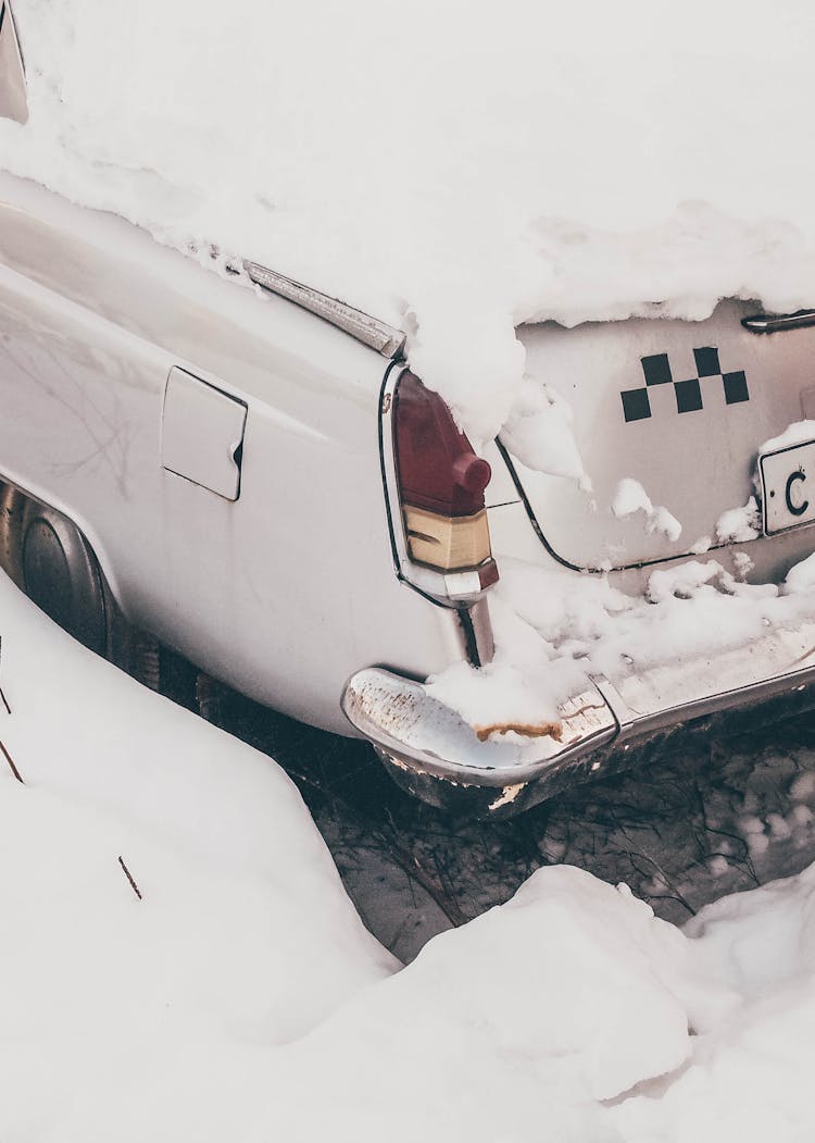 White Car Covered With Snow