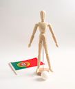 Brown Wooden Human Figure on White Surface