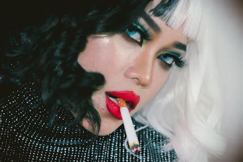 Close Up Photo of a Woman Smoking Cigarette