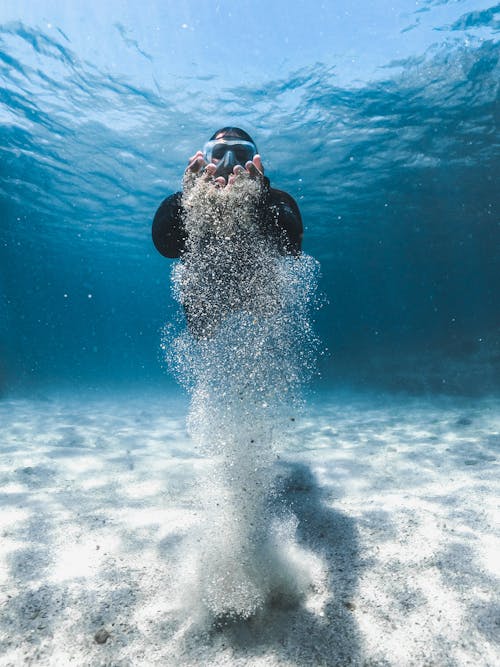 Free Man in Mask Diving Underwater Stock Photo