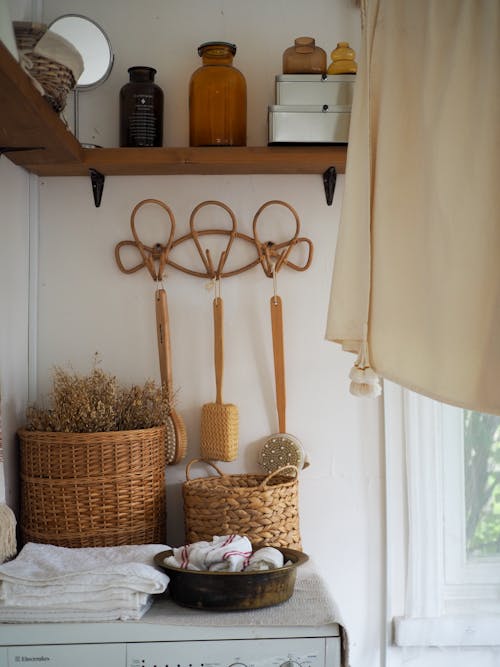 Baskets Bottles and Hanging Back Brushes in Bathroom