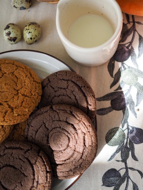 Plate of Cookies Beside a Ceramic Cup