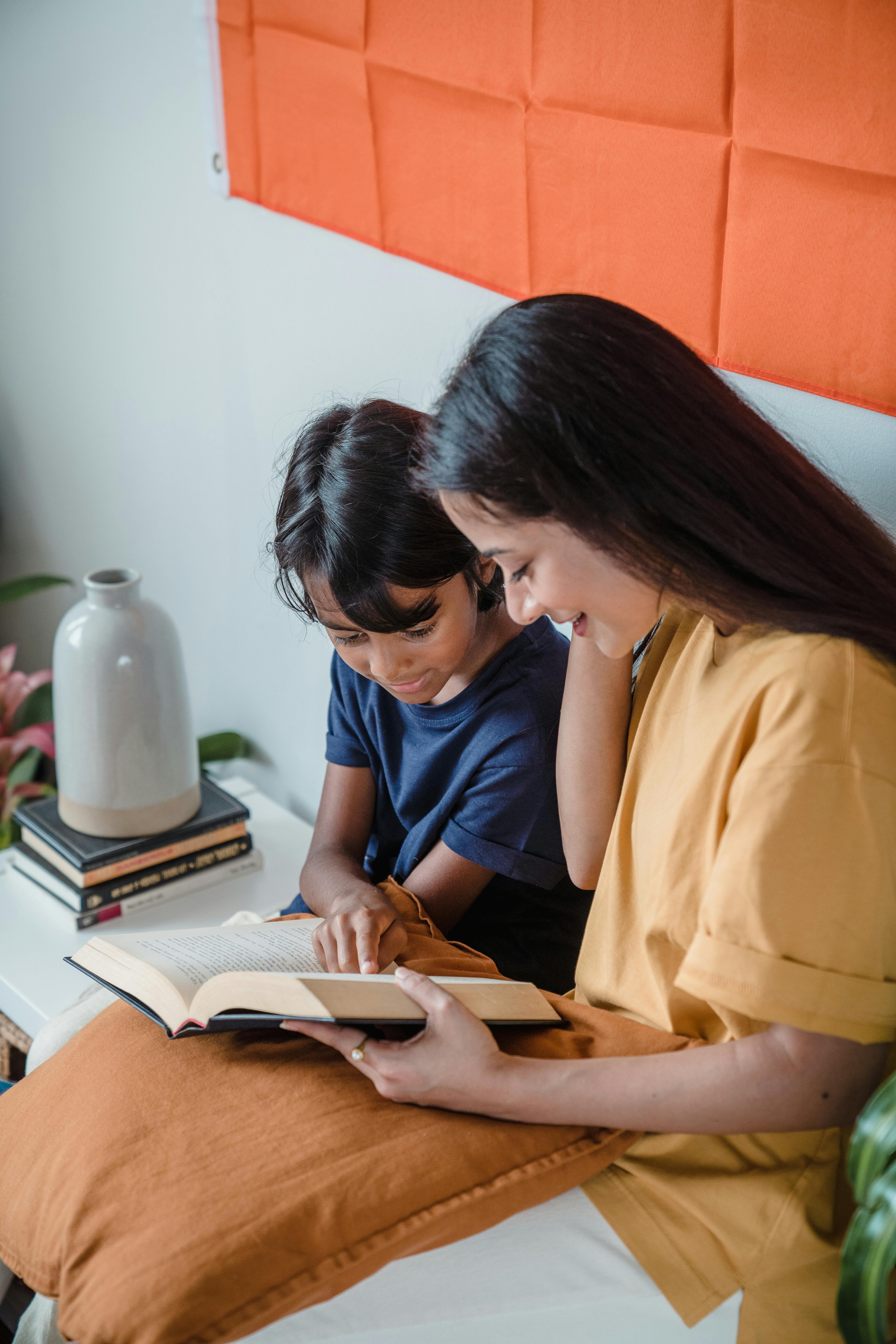 a mother and son reading a book