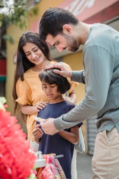 Family enjoying a day out at a colorful outdoor market, browsing various items.