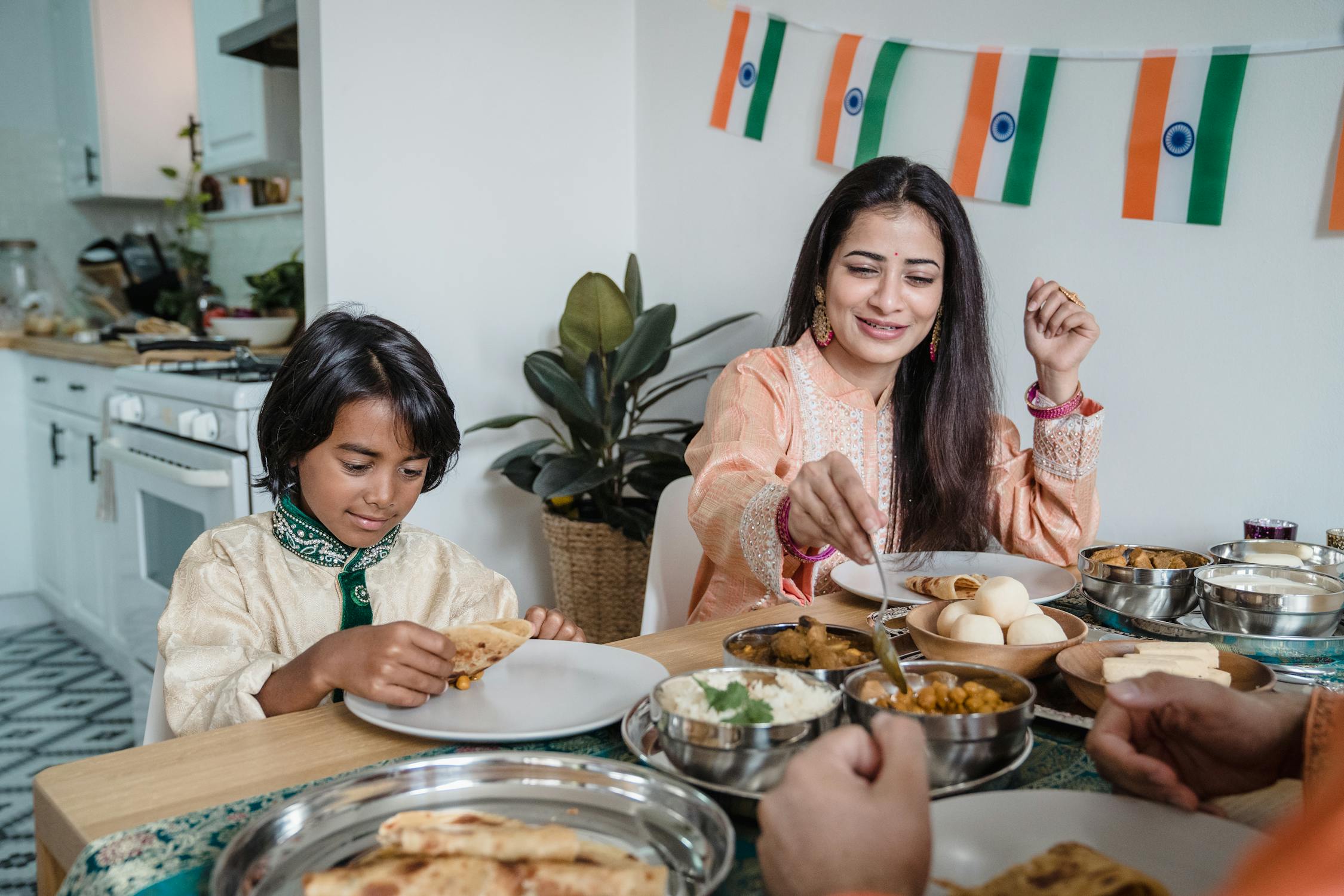 Indian Flag Photo by Anna Pou  from Pexels: https://www.pexels.com/photo/woman-in-pink-and-white-floral-long-sleeve-shirt-sitting-beside-woman-in-green-and-white-9345661/