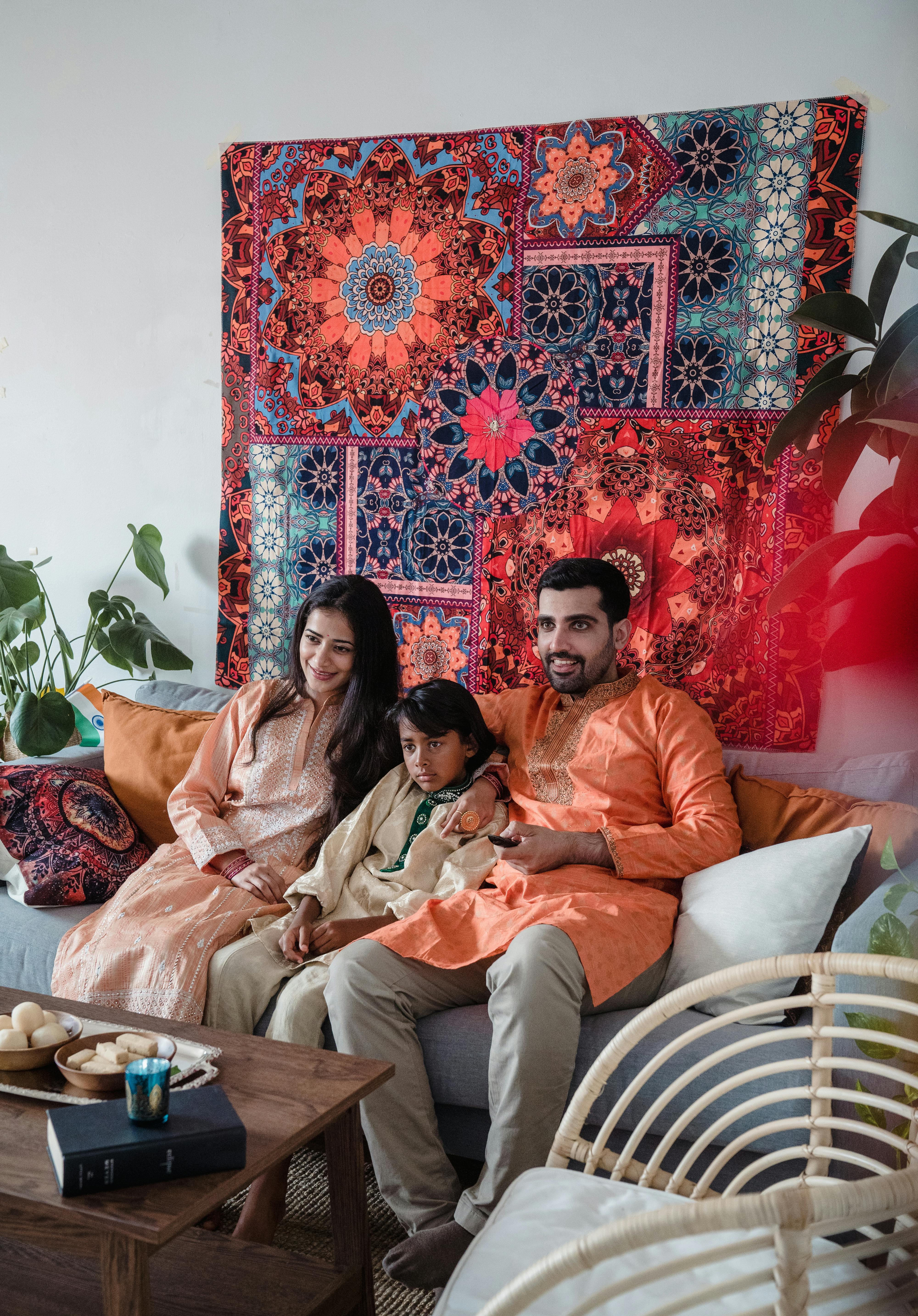 woman in orange dress sitting on couch