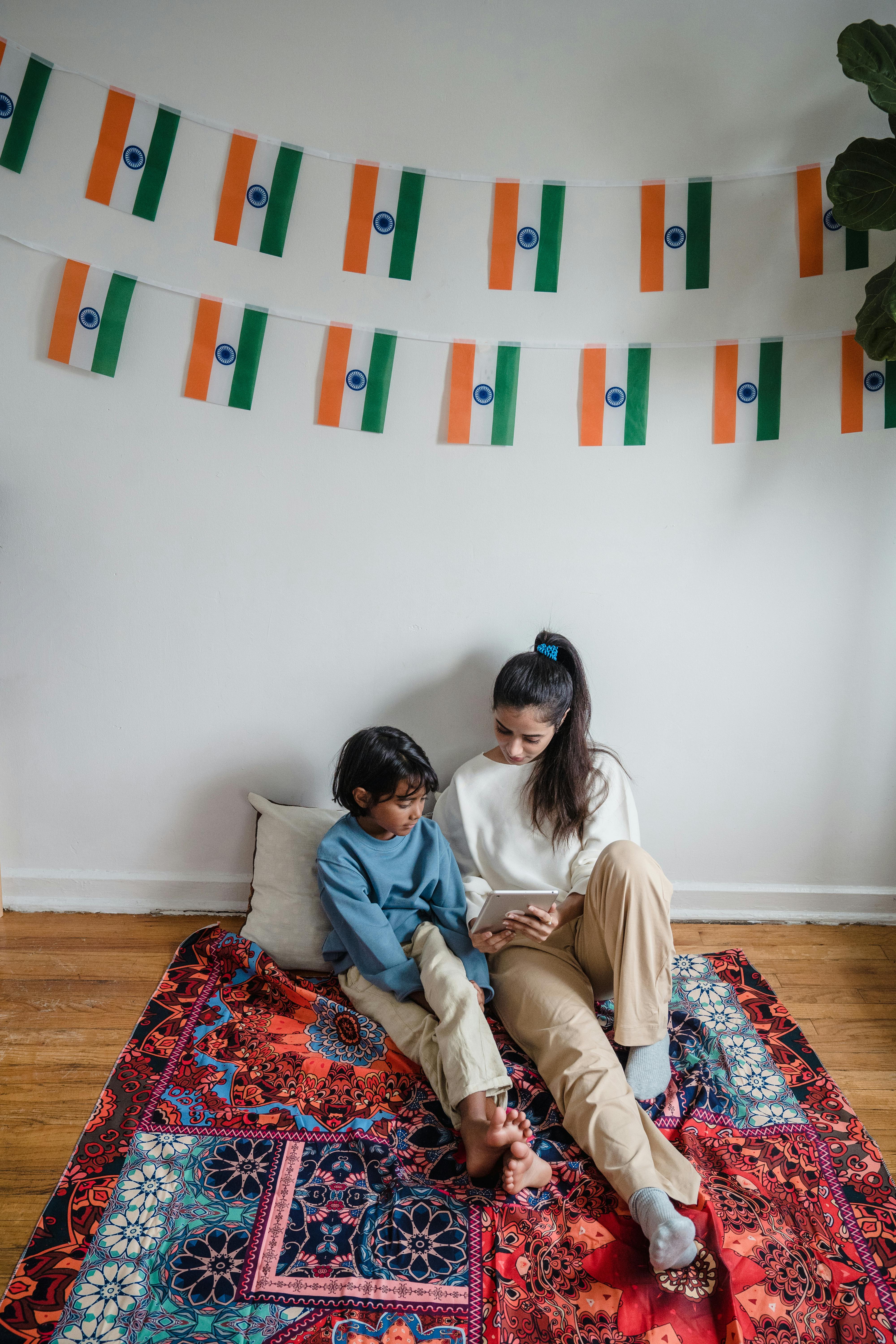 man and woman sitting on couch