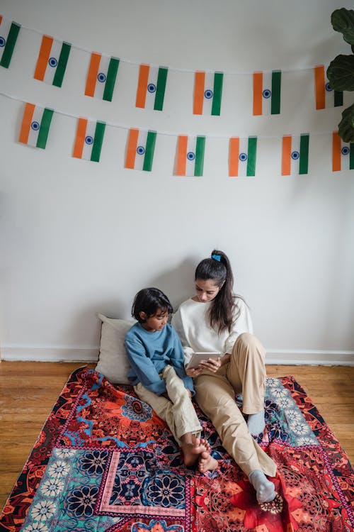 Man and Woman Sitting on Couch